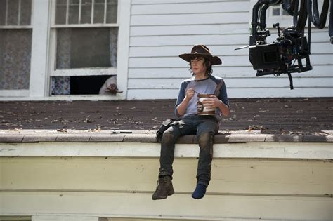 when does carl die in the walking dead